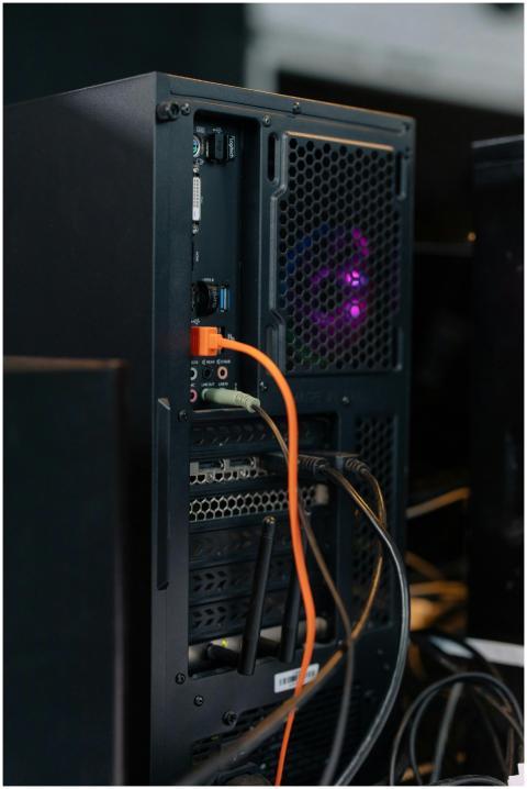 Close-up of a desktop computer tower with connecte