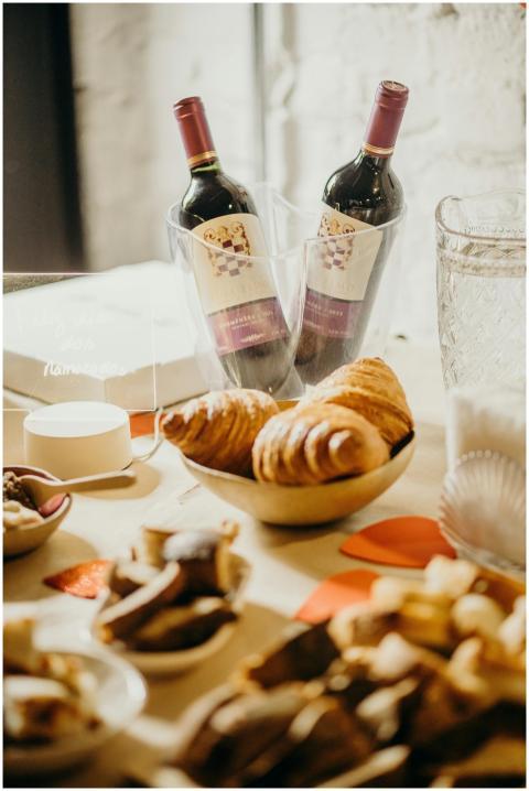 Charming arrangement of wine bottles with pastries