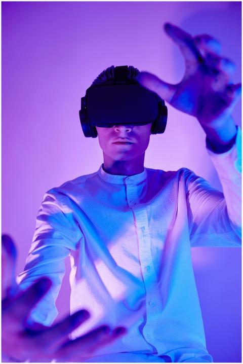 Person immersed in virtual reality using VR goggle