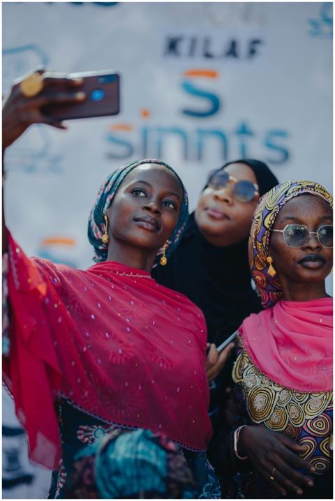 Three young women take a selfie, celebrating cultu