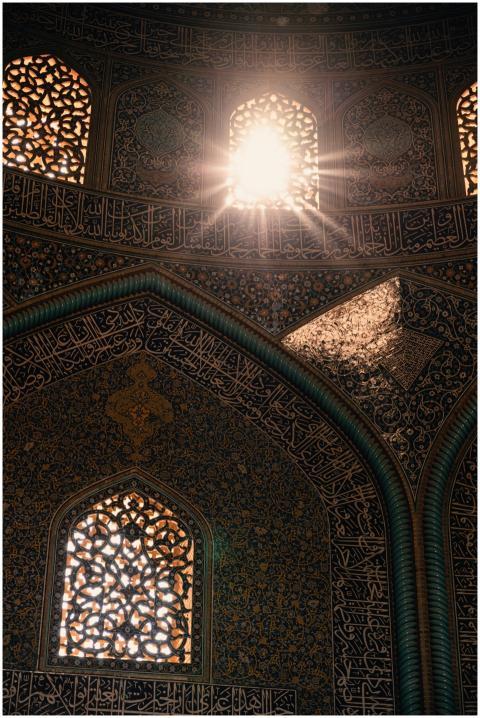 Sunlight streaming through ornate mosque windows h