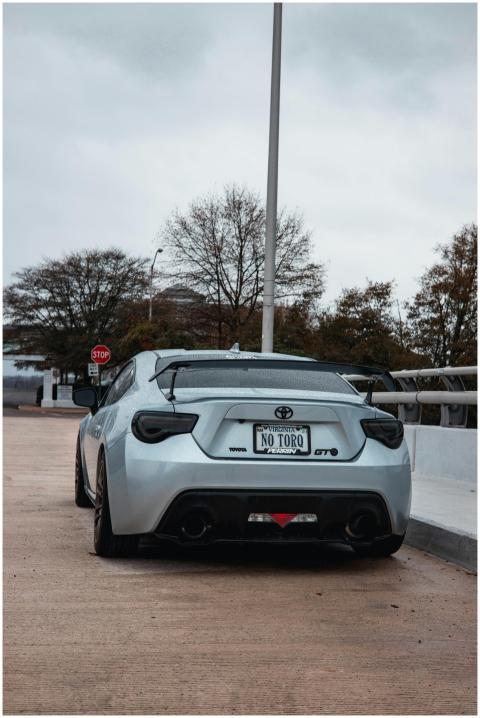Back view of a silver Toyota GT86 sports car parke