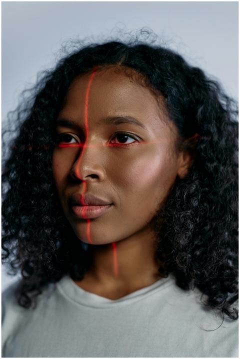 Close-up portrait of a black woman with laser scan