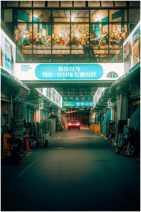 Illuminated market street in Seoul, showcasing vib