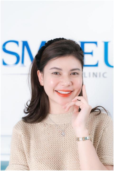 Portrait of a smiling woman in a beauty clinic set