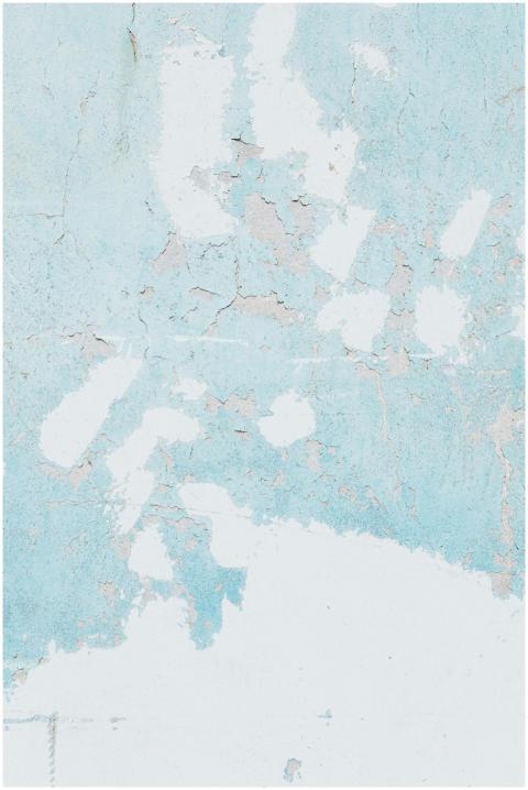 Detailed texture of a peeling blue concrete wall,