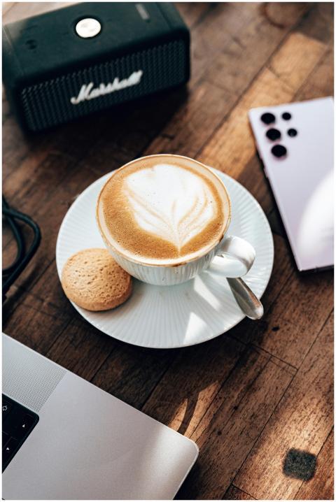 High angle view of cappuccino with latte art, cook