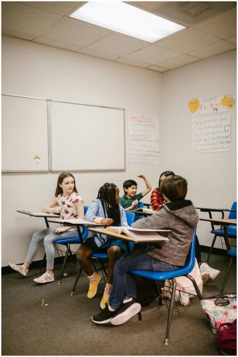 A group of diverse children interact in a modern c