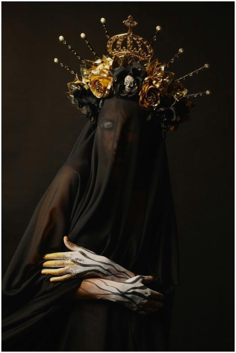 Mysterious figure draped in black veil and ornate