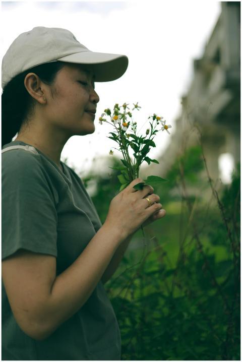 Woman Enjoying Nature Wildflowers