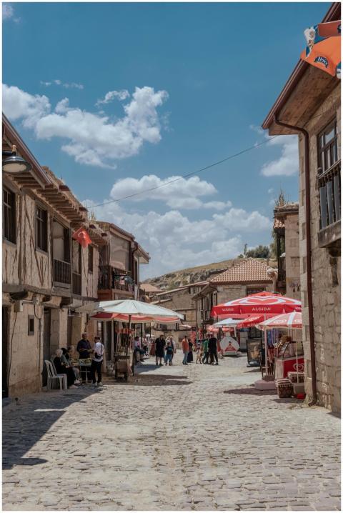 Explore the quaint stone houses and vibrant street