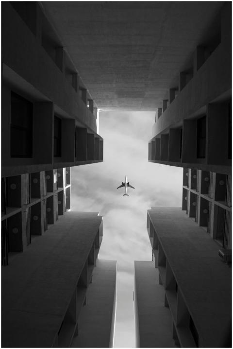 Low angle of symmetrical buildings against sky wit