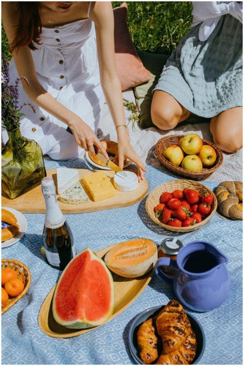 Relaxing outdoor picnic with a variety of fruits a