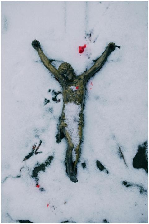 A crucifixion sculpture in snow, symbolizing relig