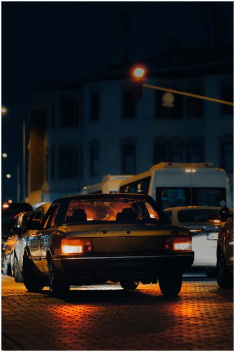 A vibrant city street captured at night featuring