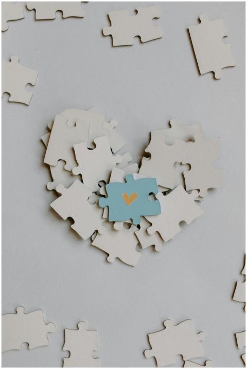 A heart-shaped puzzle arrangement with a central b