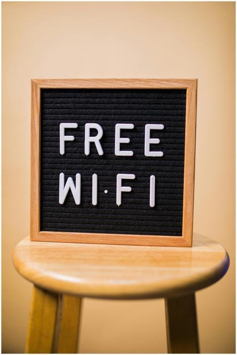 Letterboard displaying 'Free Wi-Fi' on a wooden st