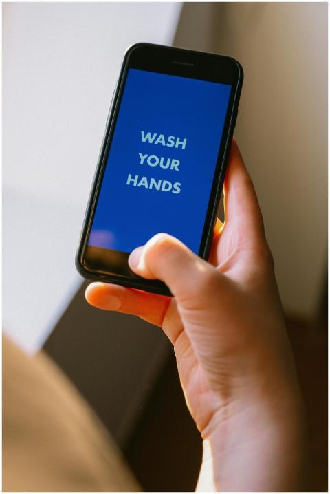Close-up of a hand holding a smartphone displaying