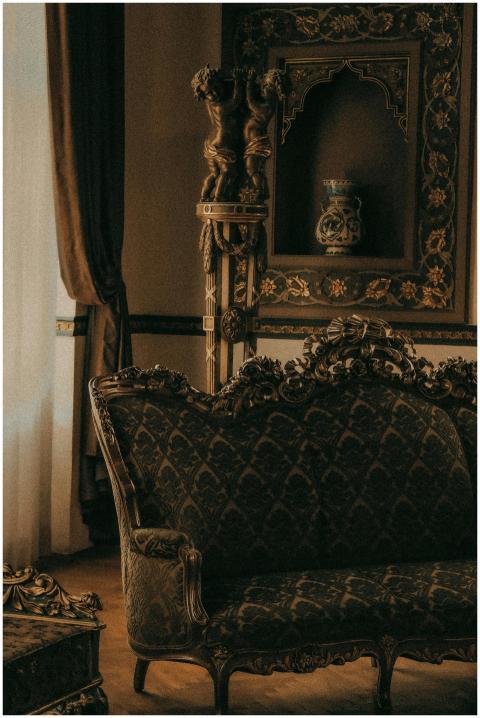 Vintage ornate sofa in luxurious room with classic