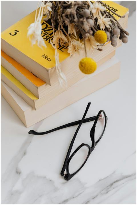 Aesthetic arrangement of books, dried flowers, and