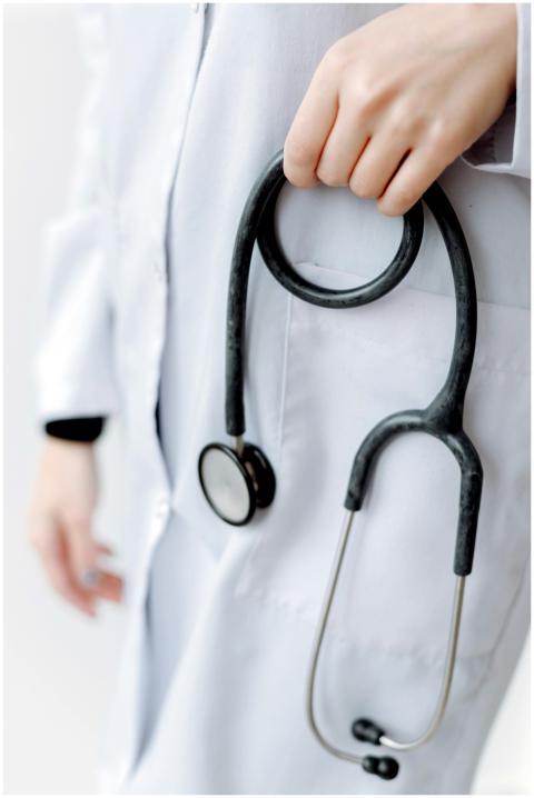 Close-up of a doctor holding a stethoscope, showca