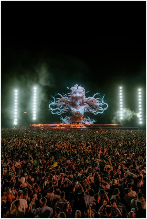 Vibrant night concert scene with a massive crowd e