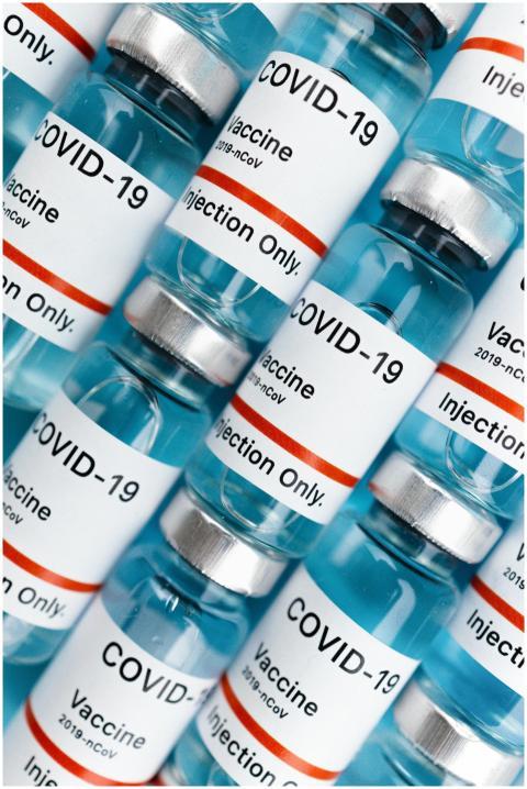 Detailed shot of COVID-19 vaccine vials labeled fo