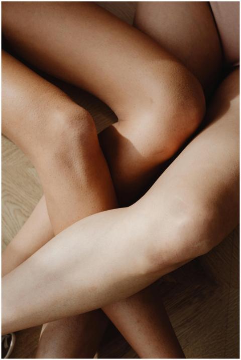 Close-up overhead shot of intertwined legs showcas