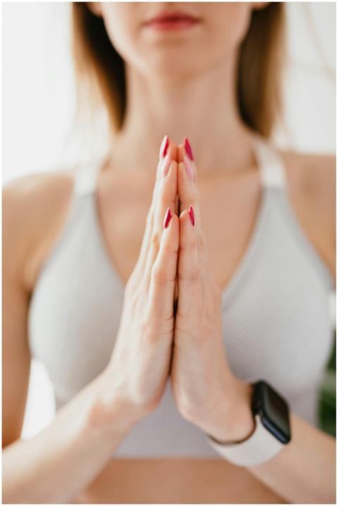 Close-up of a woman in a yoga pose, focusing on mi