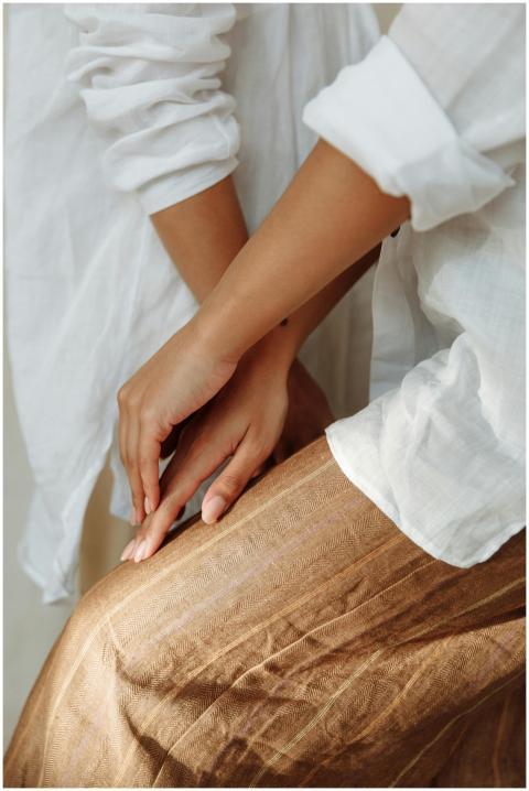 Elegant close-up of hands resting gently on a text