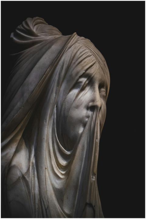 Close-up of veiled statue with intricate details a