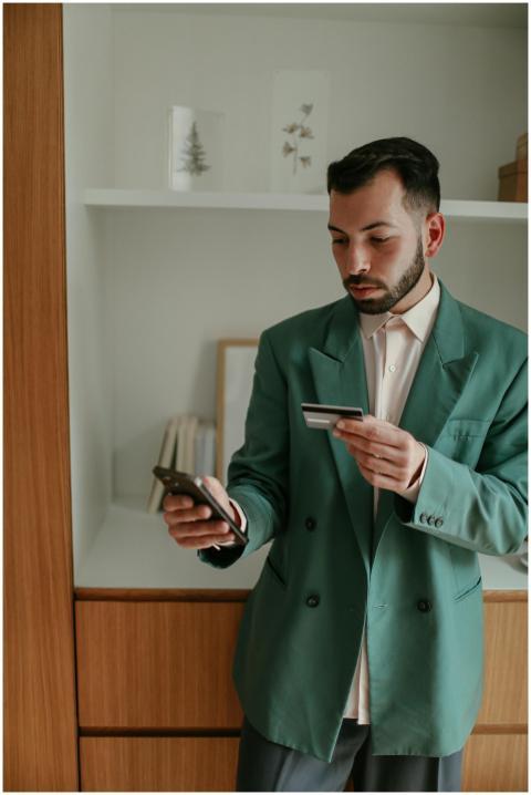 Businessman using smartphone and credit card with