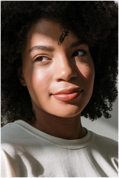 Close-up portrait of a smiling woman with natural