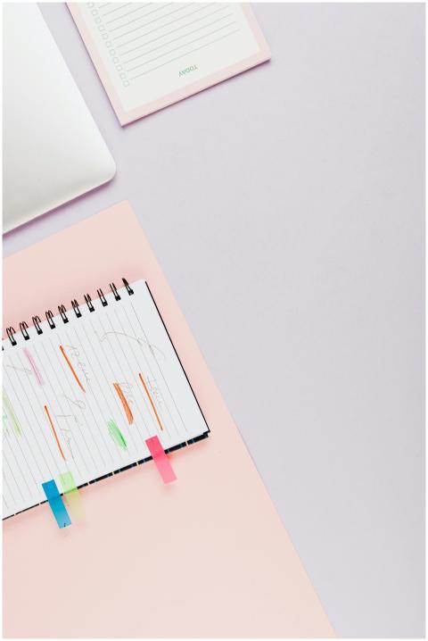 Top view of a spiral notebook with colorful sticky