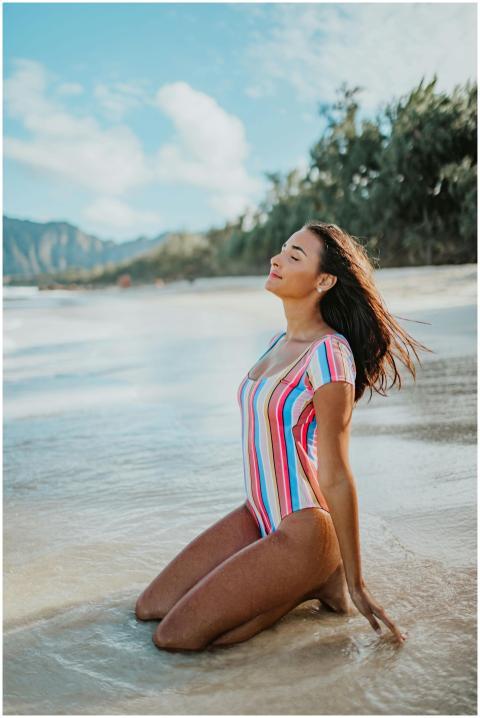 Woman enjoying a sunny day on a tropical beach in