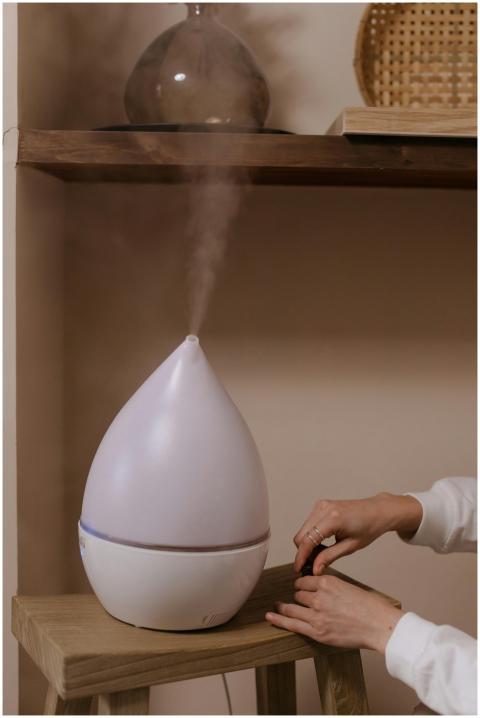 A modern humidifier releasing steam, enhancing amb