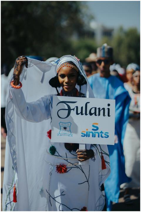 Colorful Fulani cultural parade with people in tra