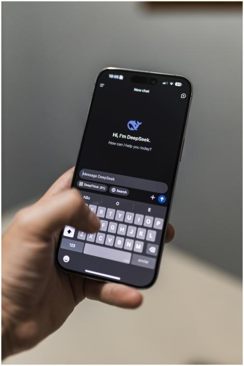 Close-up of a smartphone with an AI chat interface