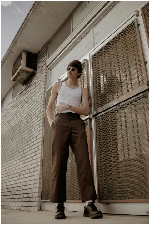 Stylish male model in urban setting, showcasing re