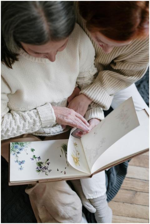 Mother and daughter share a moment looking through