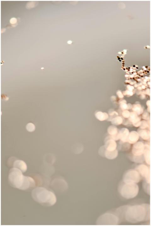 Close-up of soft sparkling glitter against a neutr