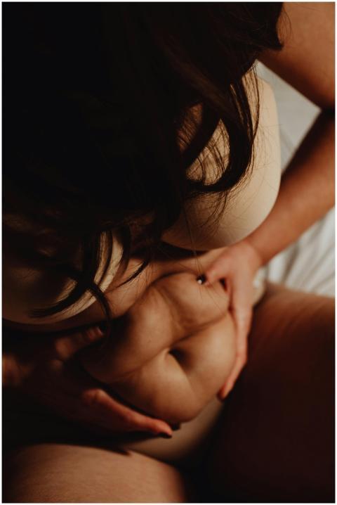 Intimate portrait of a woman embracing her body wi