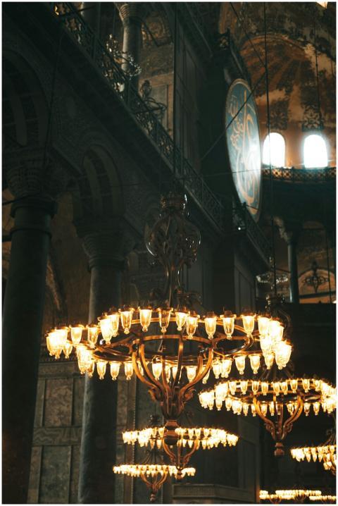 Chandeliers light up the ornate interior of Hagia