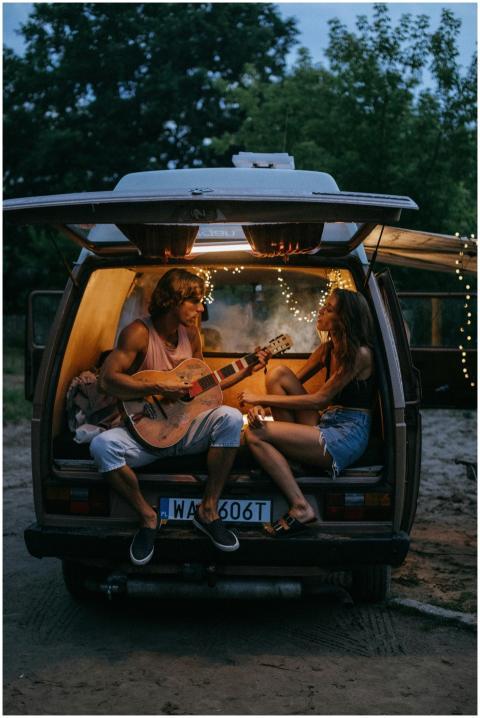 A couple enjoys a relaxing evening with guitar mus