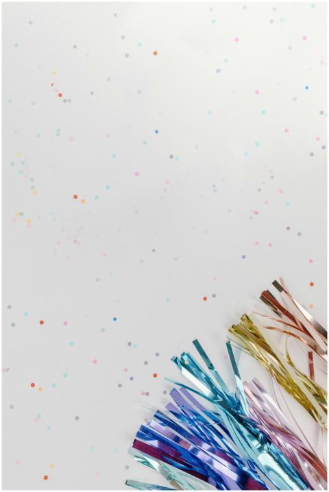 Vibrant background with scattered confetti and met