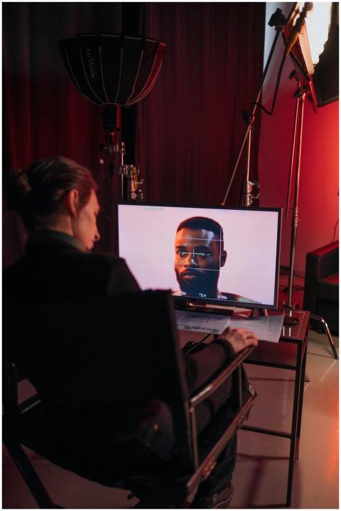 A video editing professional working in a studio w