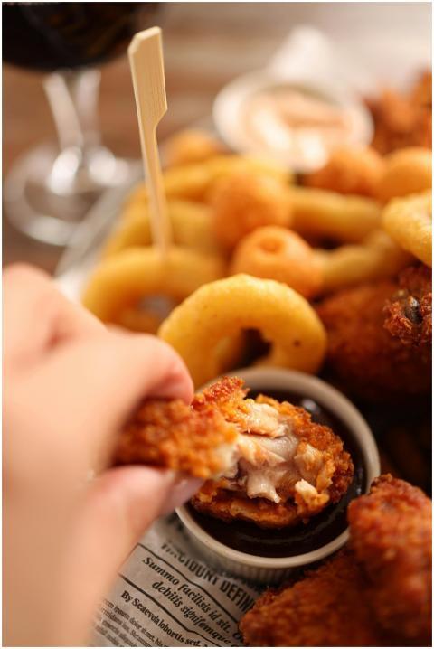 Delicious close-up of crispy fried chicken and oni