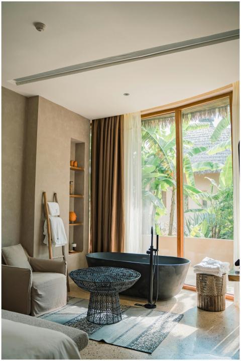 Elegant bathroom featuring a modern tub and tropic