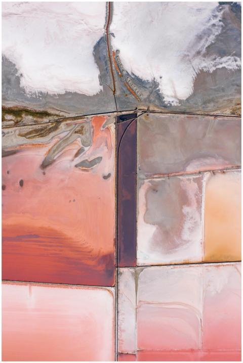 Stunning aerial shot of colorful salt flats displa