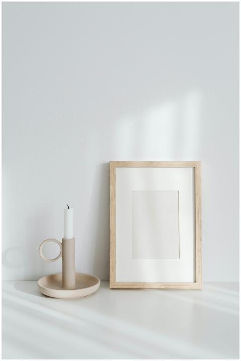 Elegant minimalist composition featuring a candle
